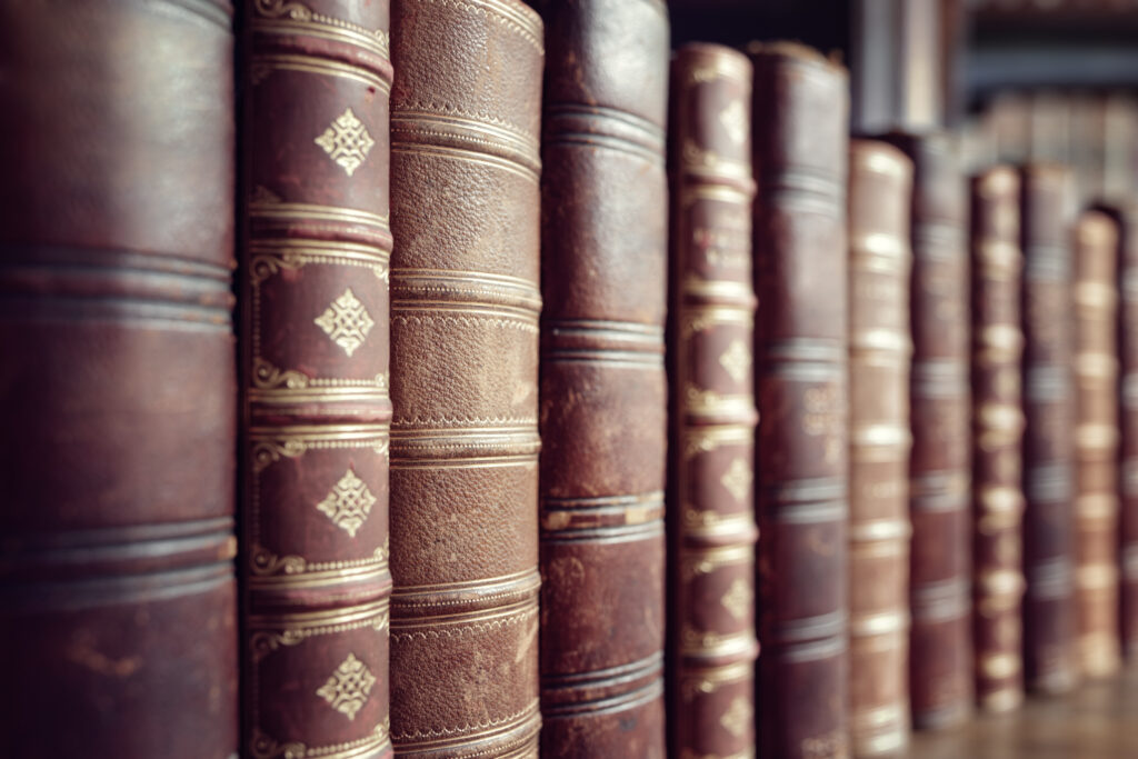 Old leather bound vintage books in a row